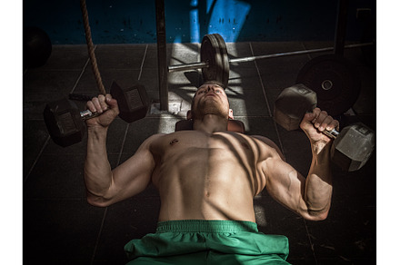 Handsome young man doing abs