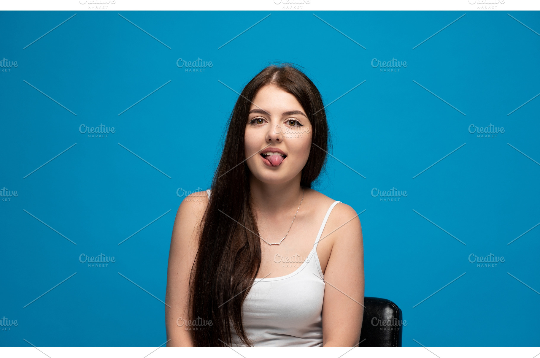 Young woman playfully sticking out, a Person Photo by volodymyrshtun13795