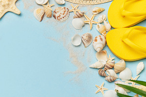 Beach accessories creating summer holiday mood on blue backgroun, a Holiday Photo by Olena Rudo