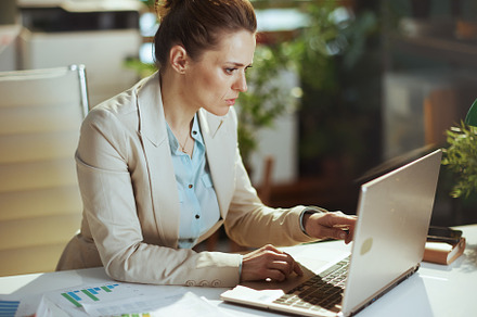 accountant woman in light business suit in green office, a Business Photo by Alliance Images