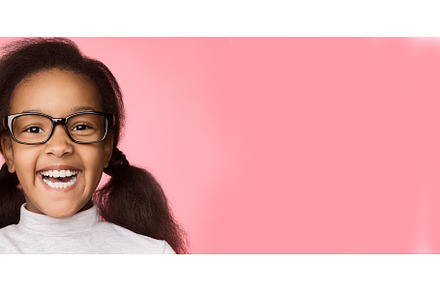 Africanamerican girl in eyeglasses containing african-american, black, and, a Person Photo by Prostock-Studio