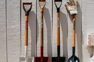 Summer tools hanging on wooden wall, a Business Photo by Virgo Studio