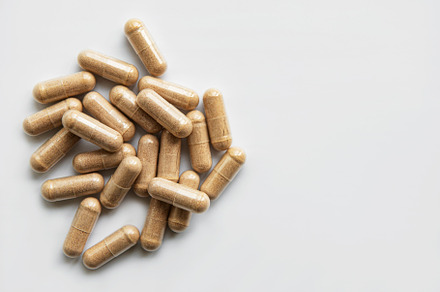 Herb casules on a white background containing herbal, drug, and pill, a Health & Medical Photo by Olena Rudo
