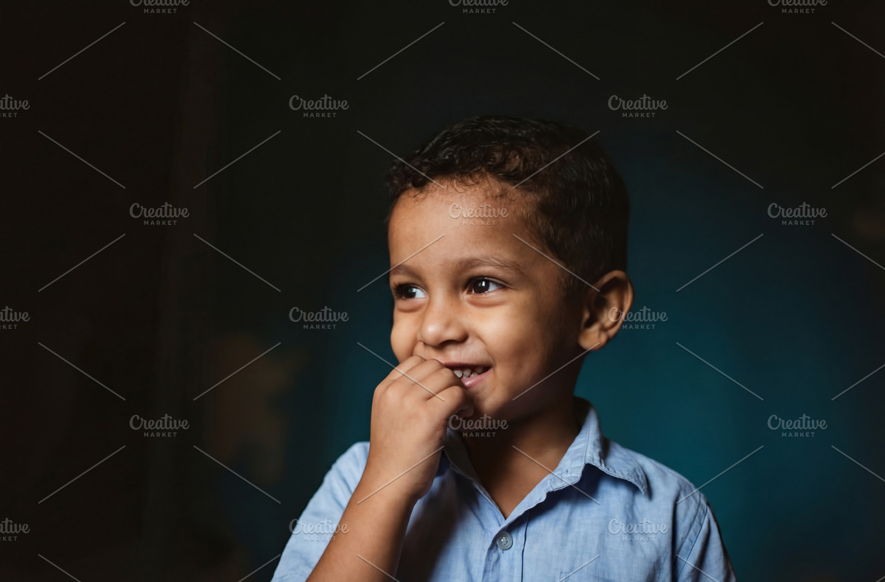 Portrait of Young Boy with Shy Smile, a Person Photo by Virgo Studio