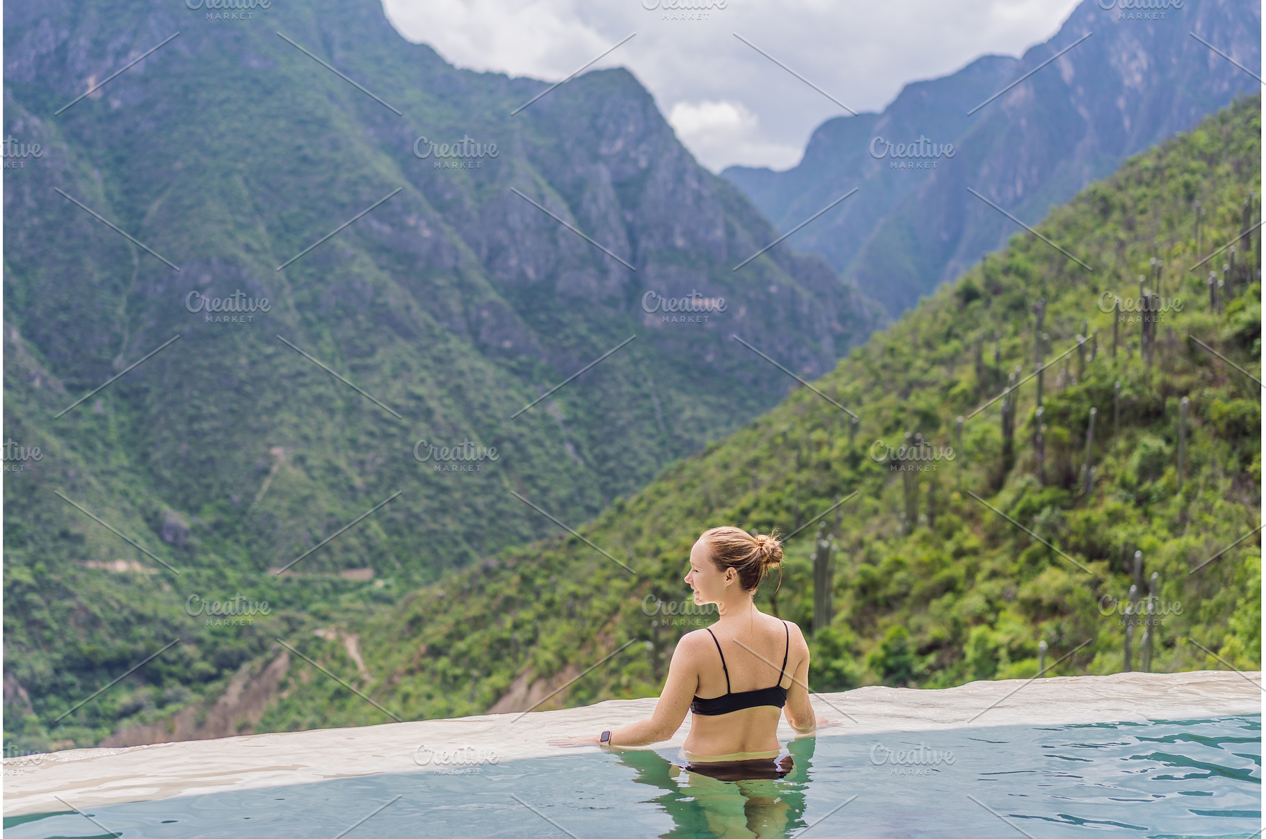 Female tourist exploring Grutas, a Nature Photo by Elizaveta Galitskaya
