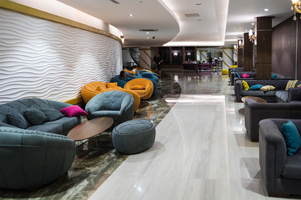 a variety of modern style sofas in the lobby of a Turkish hotel, an Architecture Photo by TanaCh