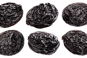 Prunes isolated on white background, a Food & Drink Photo by Max Lashcheuski