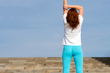 Woman doing warm up before workout, a Sports & Recreation Photo by Elena Vagengeim
