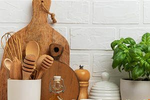 Kitchen utensils, eggs, and basil creating a rustic culinary sce, a Food & Drink Photo by Olena Rudo