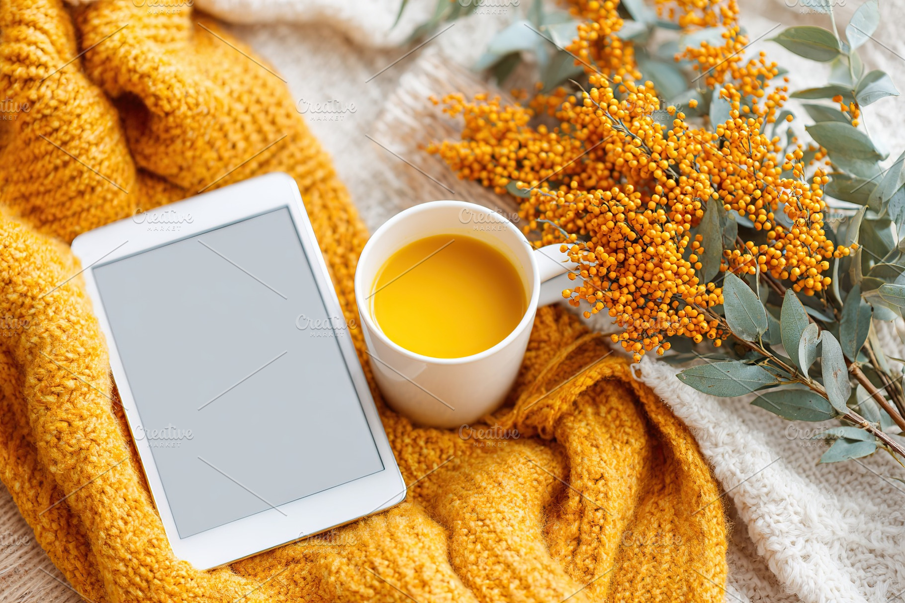 E-ink notepad and stylus beside a warm drink and autumn foliage on a cozy blank, a Food & Drink Photo by AlyaAnd