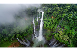 Tall aerial waterfall surrounded by, a Nature Photo by Igor Tichonow