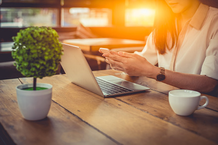 Close up of businesswoman working at outdoors office with laptop, a Technology Photo by Ministocker