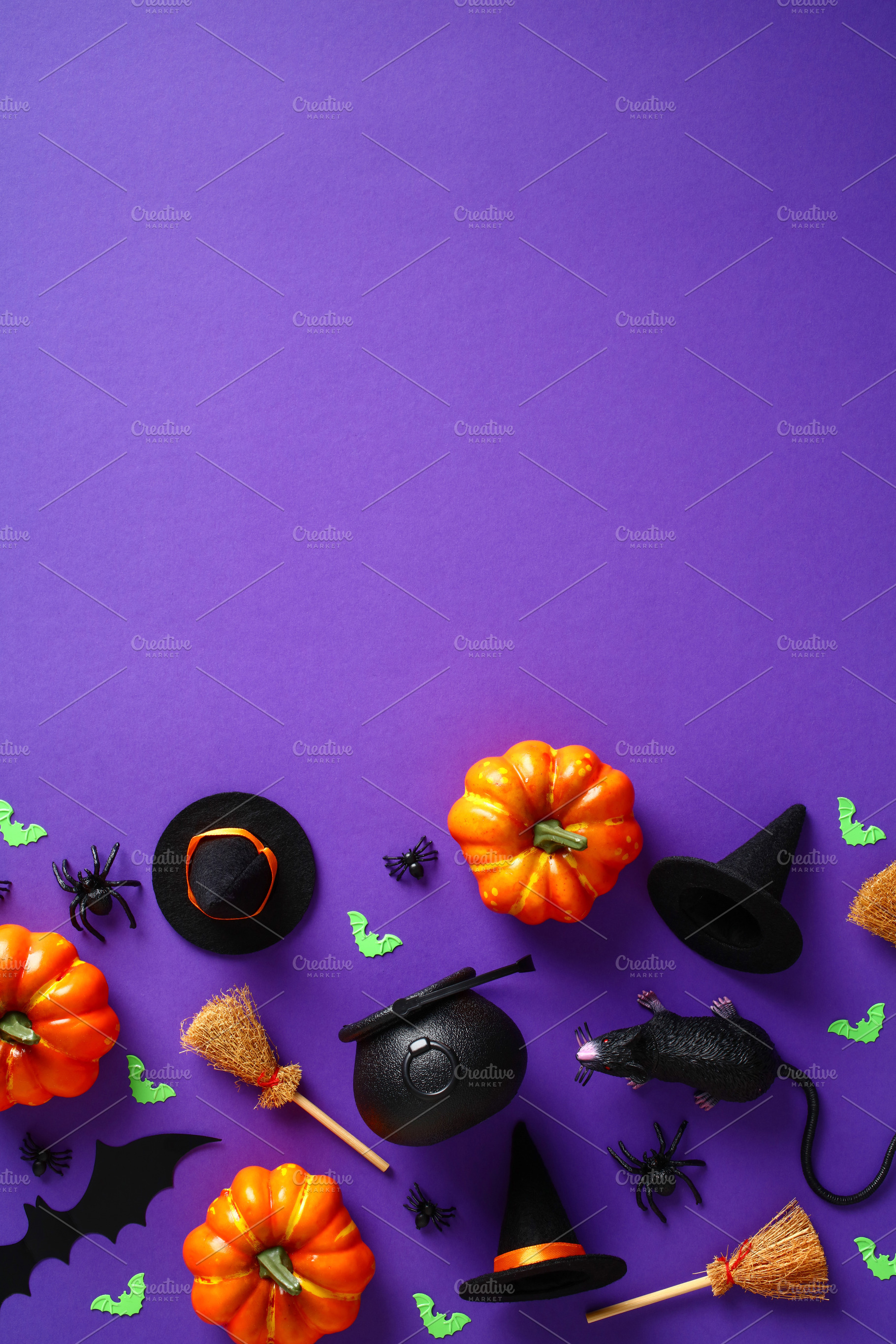 Halloween background with decorations, pumpkins, spiders, bats, witch hats and, a Holiday Photo by photoguns