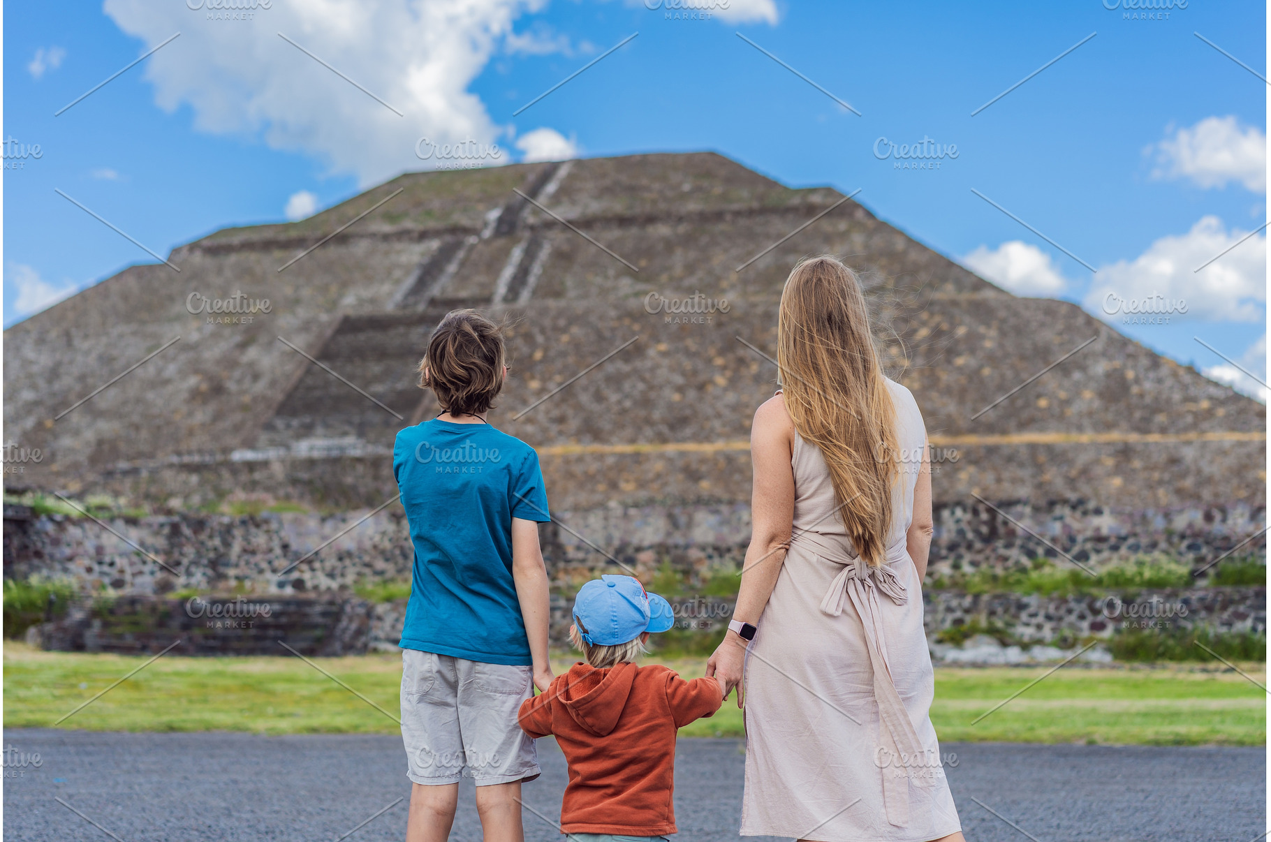 Mother with her two sons as tourists, an Architecture Photo by Elizaveta Galitskaya