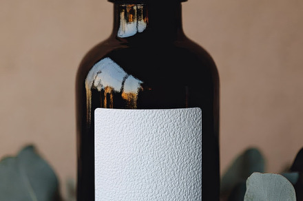 Dark Glass Bottle White Label Mockup, a Background Photo by Virgo Studio