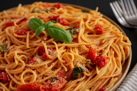 Homemade Spaghetti With Fresh Tomato Sauce on a Plate, side view, a Food & Drink Photo by LiudmylaChuhunova