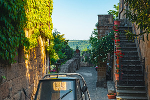 Parked small old vehicle in the city, a Transportation Photo by Alpine Dreams