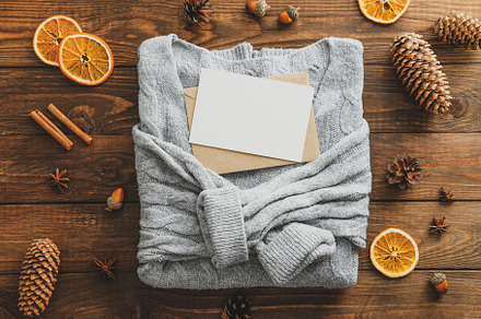 Wooden table with knitted sweater, a Holiday Photo by photoguns