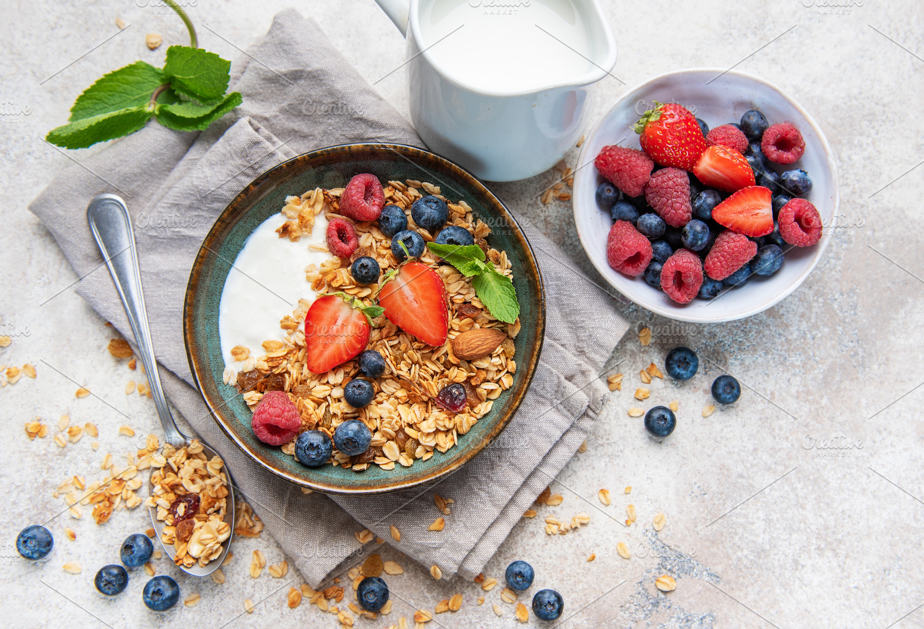 Healthy breakfast granola yogurt bowl with fresh berries, a Food & Drink Photo by Olena Rudo