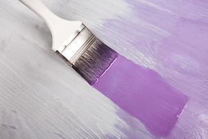 Painting wooden boards purple with