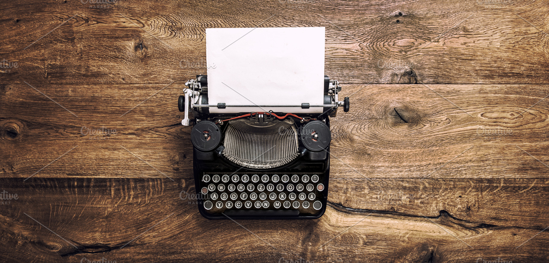 Vintage typewriter with paper containing typewriter, vintage