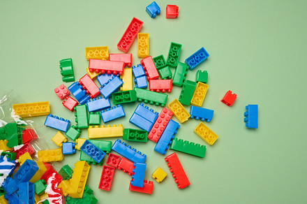 Scattered plastic multi-colored parts of children's construction, a Background Photo by ndanko