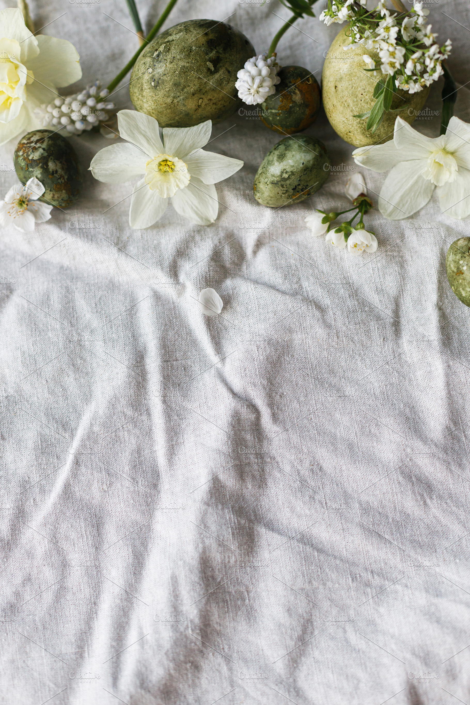 Easter flat lay. Stylish easter eggs, daffodils flowers and cher, a Holiday Photo by Sonjachni