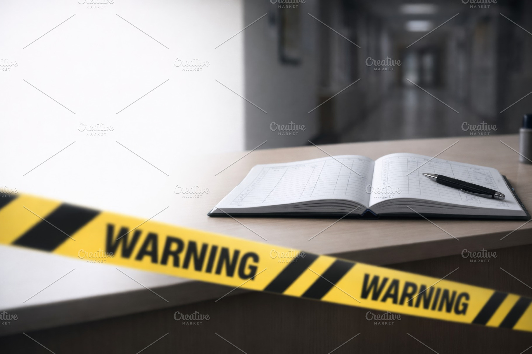 Warning tape and open logbook on des, a Photo by Dvoevnore photos