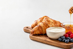 Breakfast grazing board with croissa, a Photo by Dvoevnore photos