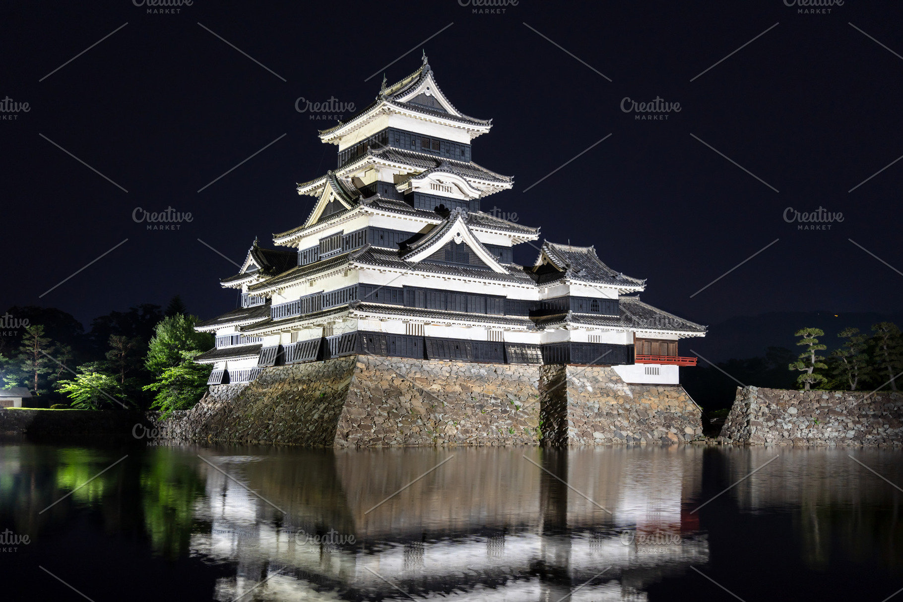 Night view of Matsumoto Castle reflecting in the water, Japan, an Architecture Photo by GoodGoods