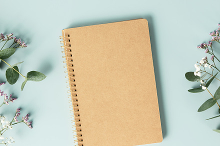 Notebook and flowers on blue background. Flat lay top view copy, a Holiday Photo by Natalia Klenova's Shop