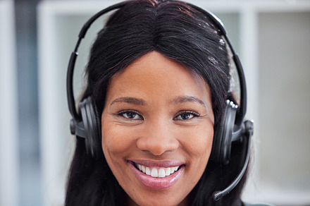 Call center, customer support and portrait of black woman consultant in corporate office for telemarketing. Customer service, crm and face of female consulting agent with smile for friendly service, a Photo by Peopleimages.com