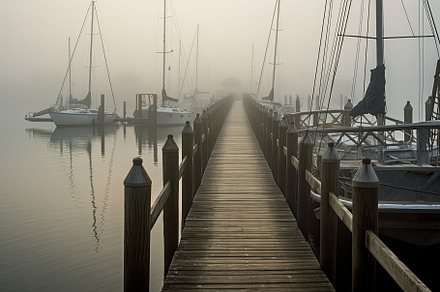 Wooden pier in a foggy morning. Yach, a Photo by Iftikhar Alam