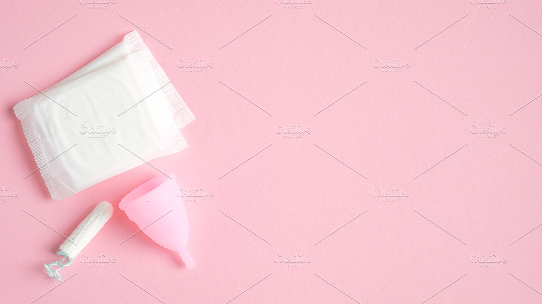 Menstrual hygiene products top view containing menstrual, cup, and tampon, a Health & Medical Photo by photoguns
