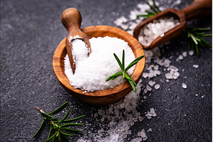 Natural sea salt crystals on dark, a Food & Drink Photo by Yulia Furman