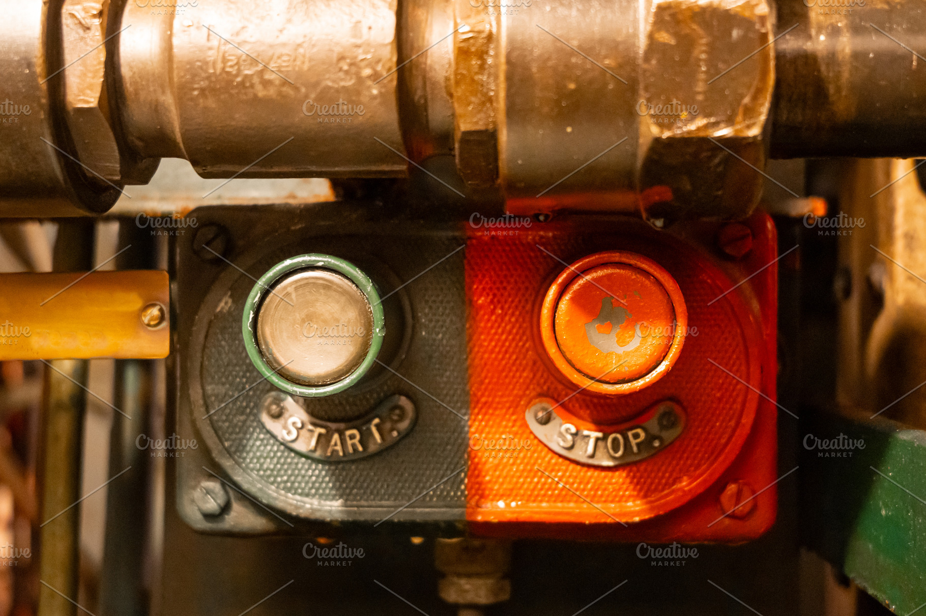Start and stop buttons inside an old military submarine control, an Industrial Photo by GoodGoods