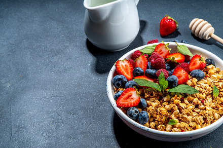 Healthy breakfast granola with berry, a Food & Drink Photo by Rimma