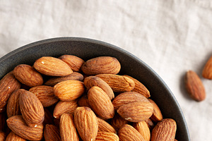 Roasted Almonds in a Bowl, top view. Flat lay, overhead, from ab, a Food & Drink Photo by LiudmylaChuhunova