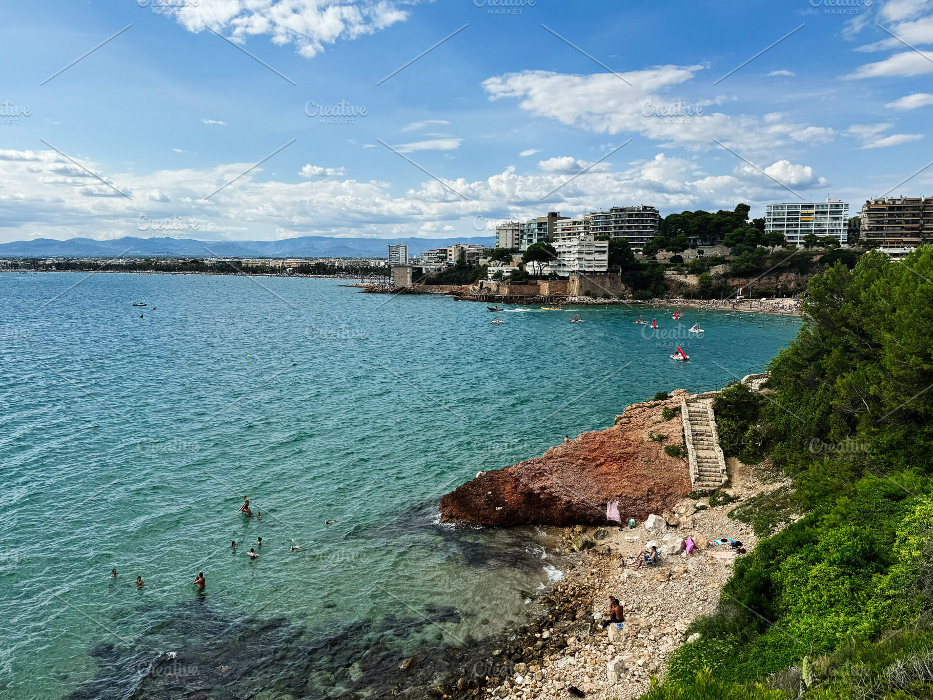 Coastal view of La Pineda beach in Tarragona, Spain on a sunny day, a Photo by AS photostudio