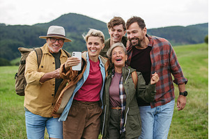 Family taking selfie on hiking trip, a Holiday Photo by HalfPoint