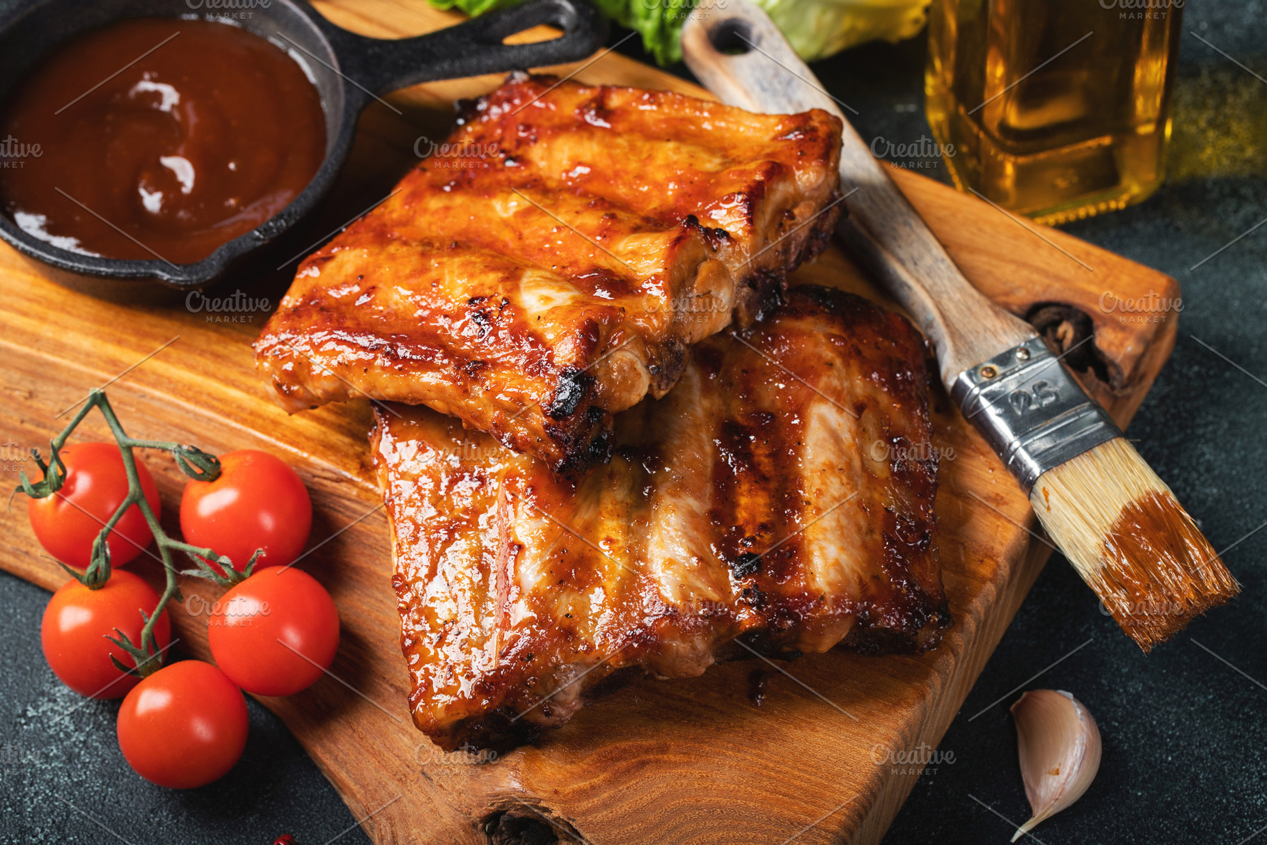 Spicy hot grilled spare ribs from a summer BBQ served with a hot chili pepper a, a Food & Drink Photo by Budarinphoto