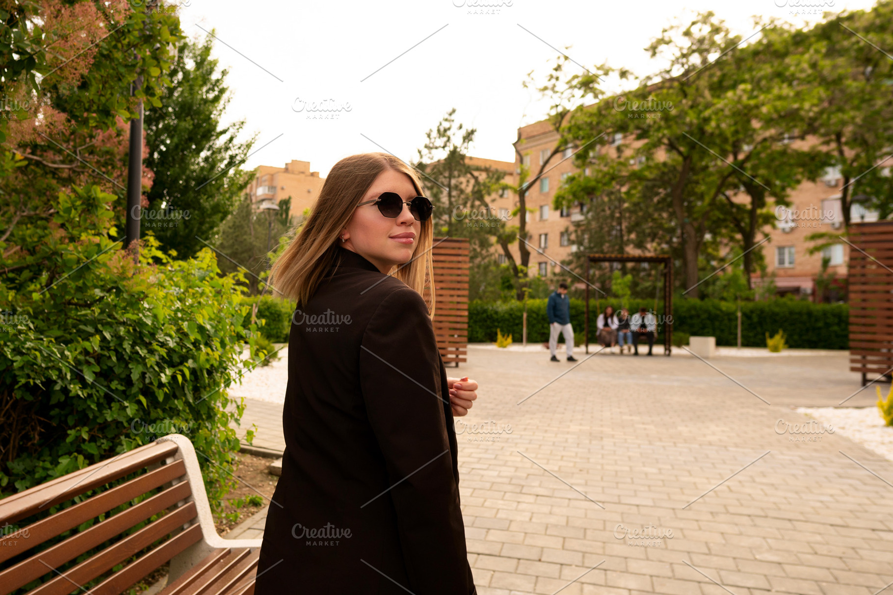 Stylish young woman walking outdoors, a Person Photo by Elena Vagengeim