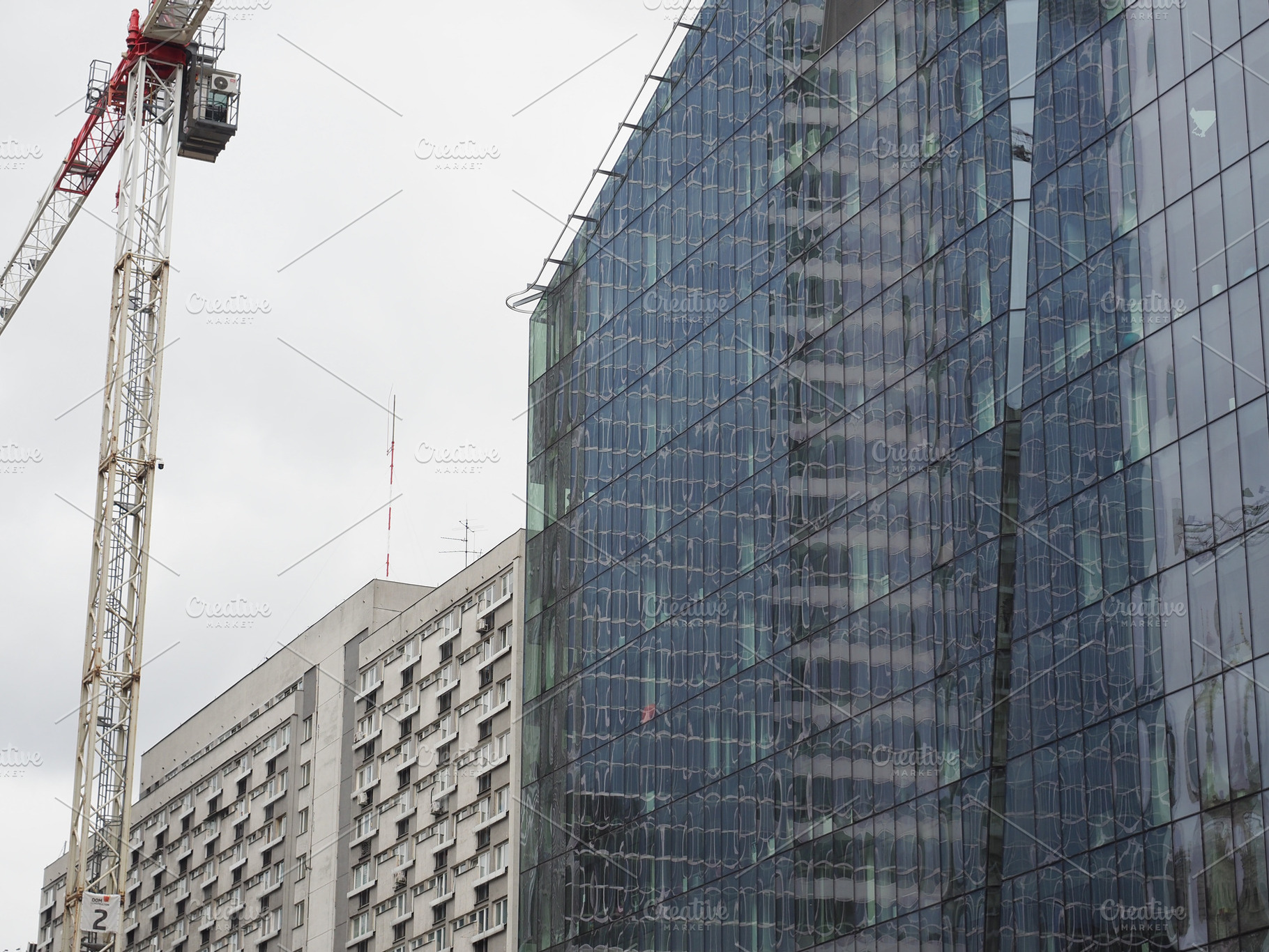 Steel and glass skyscraper and block of flats in Warsaw, a Photo by WorldOfPhotos