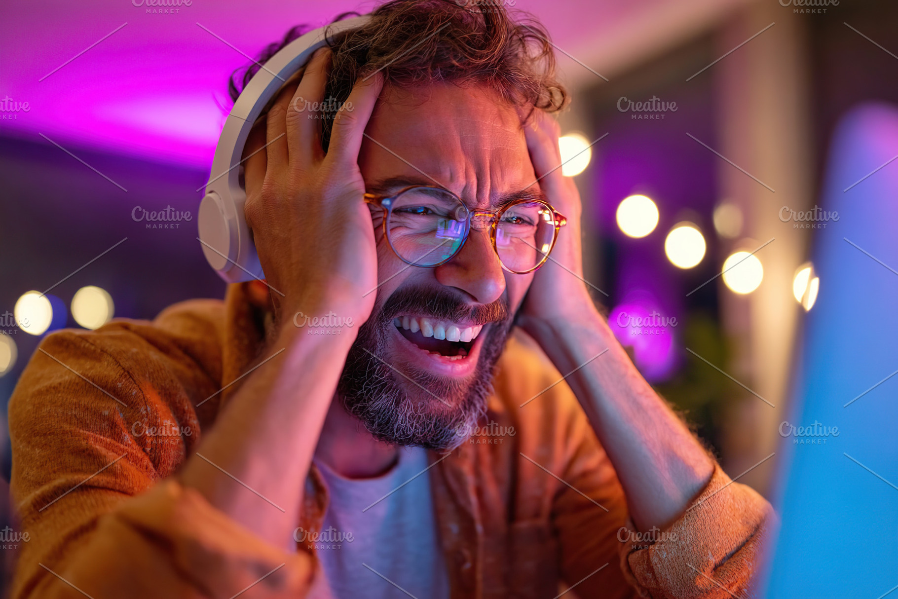 Excited gamer reacts to thrilling moment during late-night gaming session at ho, a Person Photo by AlyaAnd