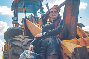 Low angle vertical portrait of red haired woman with helmet near, a Photo by Pictures for you!!!!!!!!!