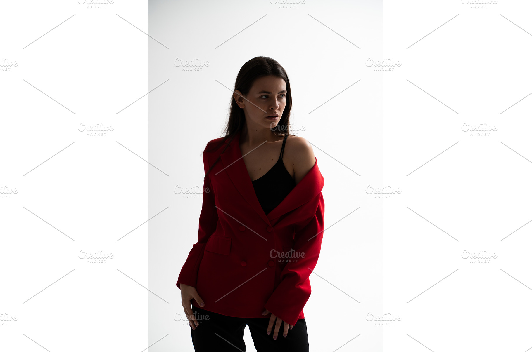 Young woman styling a red blazer, a Person Photo by volodymyrshtun13795