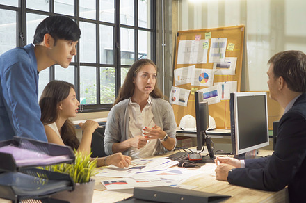 A group of multi ethnic business team talk, communicate, discuss, a Photo by Tampatra