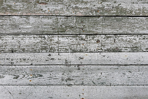 Weathered wooden planks with peeling paint in shades of gray, a Nature Photo by Textures & Backgrounds