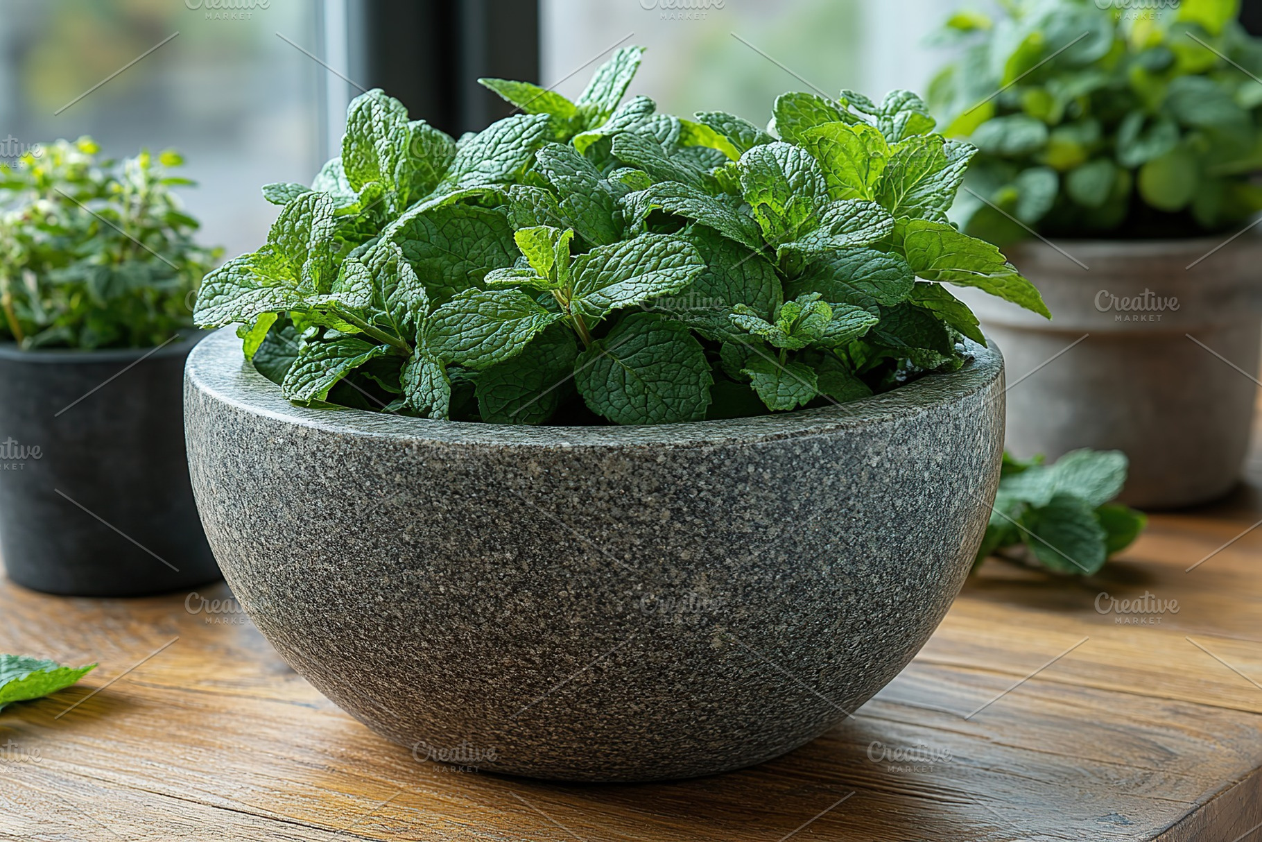 Green mint leaves in modern stone mortar on wooden table, a Food & Drink Photo by AlyaAnd