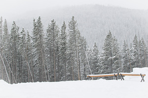 Log Benches atop a Snowy Mountain